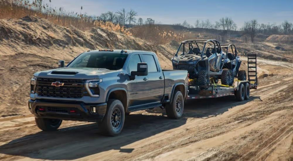 Chevy truck hauling a side by side