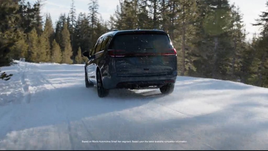 A Chrysler Pacifica is driving on snow-covered roads.